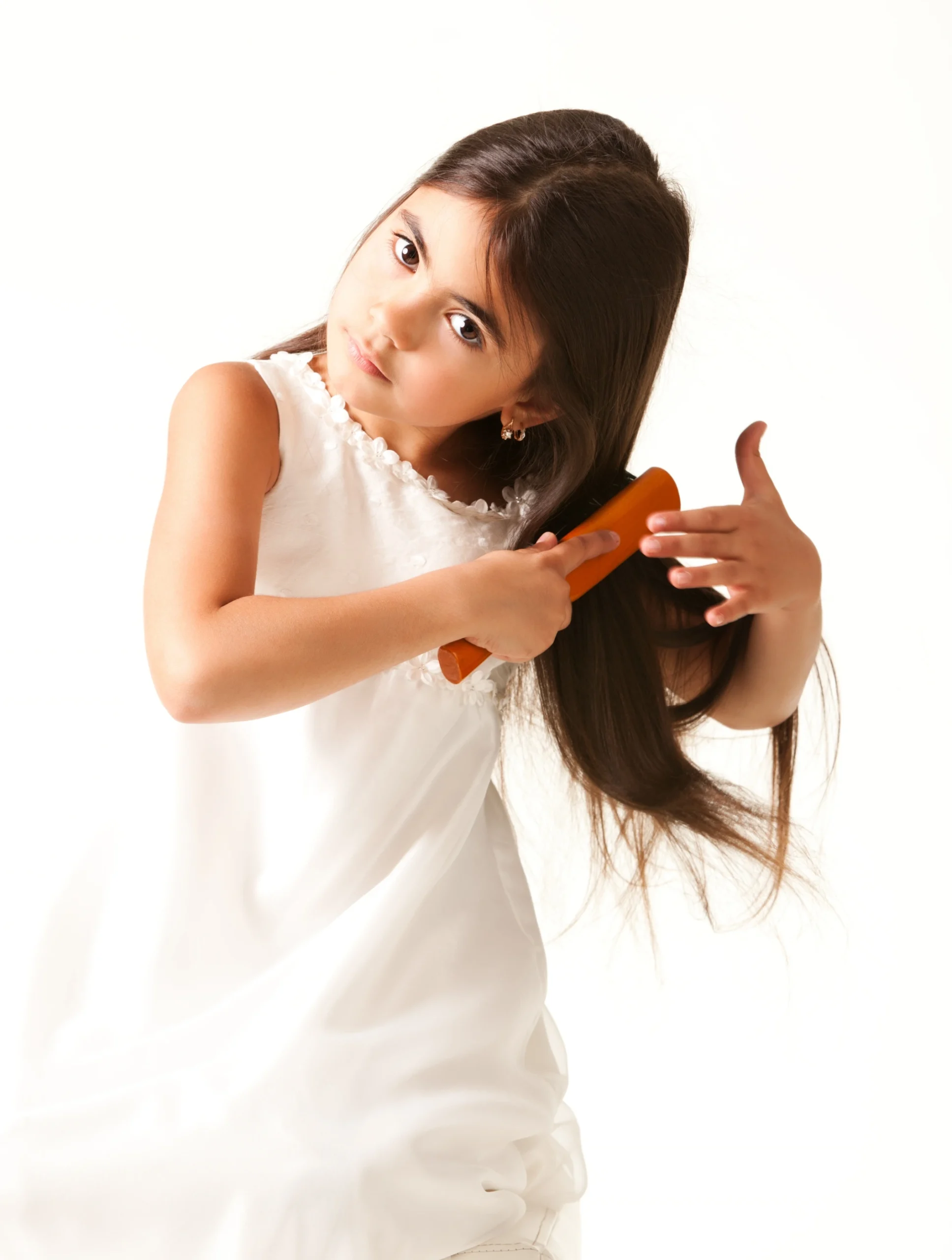 Fort Lauderdale girl in white dress combing brown hair scaled