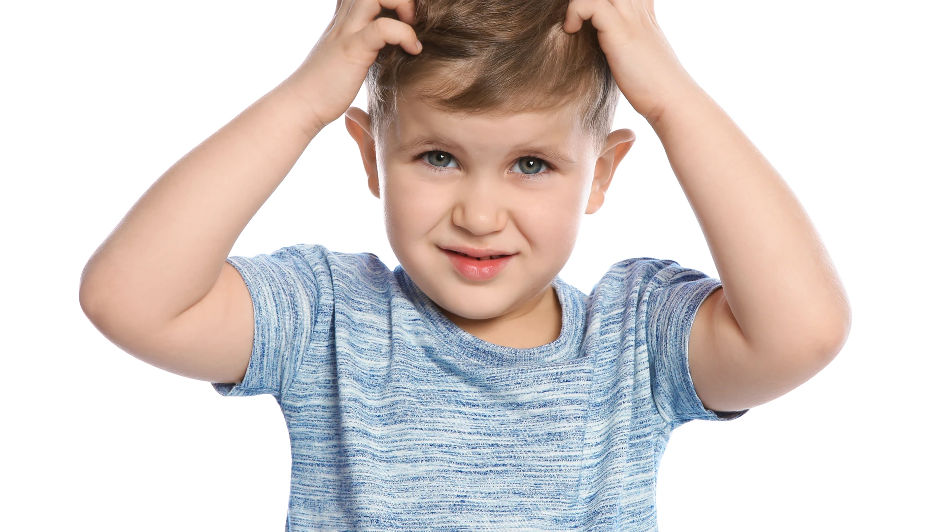 Person in a blue shirt touching their scalp with both hands